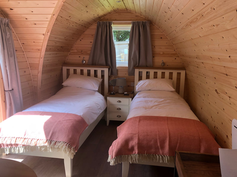 Twin beds in camping pod
